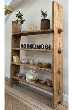 an old wooden shelf with various items on it