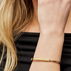 Tiffany & Co. Lock Bangle in Yellow Gold The Tiffany & Co. Lock Bangle is all about bringing people together, and this bangle is a bold symbol of those personal connections that shape us. It's made for everyone, no matter your gender, and it has this cool clasp that's like a padlock, inspired by Tiffany's history. The bangle is crafted in 18k yellow gold and a medium size fitting wrists up to 6.25 inches, this Tiffany & Co Lock Bangle is a simple, stylish way to celebrate unity and inclusivity. Details 18k Yellow Size: Medium *Fits wrists up to 6.25" Product Number: 70185636 Tiffany Bangle Bracelet, Tiffany And Co Bracelet Gold, Tiffany Lock Bracelet, Tiffany Bangle, Tiffany Bracelet, White Gold Diamond Bracelet, Tiffany And Co Bracelet, Tiffany Bracelets, Stackable Jewelry