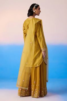 Mustard kurta with thread embroidered floral blossom patterns, embellished by sequins. Comes with sharara and dupatta. - Aza Fashions Wedding Palazzo Set With Floral Embroidery In Raw Silk, Wedding Sharara With Straight Kurta And Floral Embroidery, Wedding Chanderi Palazzo Set With Floral Embroidery, Wedding Sharara With Floral Embroidery And Straight Kurta, Designer Floral Embroidered Sharara For Transitional Season, Traditional Drape Sharara With Floral Embroidery For Eid, Designer Floral Embroidery Sharara For Transitional Season, Traditional Floral Embroidered Palazzo Set For Wedding, Traditional Floral Embroidery Palazzo Set For Wedding