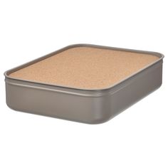 a square gray container with a cork lid