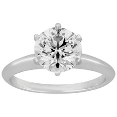 a diamond ring with a single stone in the center, set on a white background