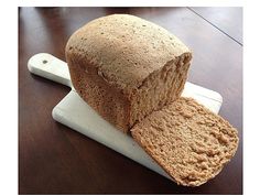 a loaf of bread sitting on top of a cutting board