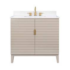 a bathroom vanity with two sinks and gold faucets on the top, against a white background