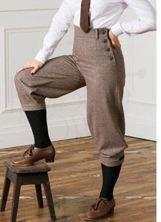 Step back in time with our Customized Wool Victorian Pant, designed for both men and women who appreciate the elegance of 19th-century historical fashion. These vintage high-waist fall front trousers not only offer a perfect fit for your unique style, but they also envelop you in warmth and sophistication--an ideal choice for any themed event or costume party; order yours today to make a timeless statement! Key features:- - wide leg - waist fit - side button fastening - one back pocket - fully lined - cuff with sider At Magnate Artisans, we believe that fashion is an art form, and your wardrobe is a canvas. Our custom-made clothing service is designed to bring your unique vision to life, offering an unparalleled level of personalization for both men and women. Whether you're seeking a dapp Victorian Pants, 40s Mode, Country Walks, Dapper Suits, Plus Fours, Regency Fashion, Herringbone Fabric, Custom Made Clothing, Fall Front