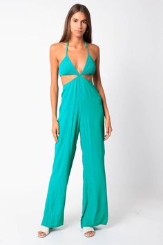 The cutest summer jumpsuit! Featuring a smocking bust, and cut outs. Fits true to size! Sami is 5'9" and wearing a medium. Summer Solid Jumpsuits And Rompers For Night Out, Spring Strapless Halter Neck Jumpsuit, Solid Color One-piece Jumpsuits For Summer, Beach Summer Jumpsuits And Rompers, Green Stretch Halter Neck Jumpsuits And Rompers, Summer Jumpsuits And Rompers For Beach, Green Strapless Jumpsuit For Summer Vacation, Green Stretch Halter Neck Jumpsuit, Summer Sleeveless Cutout Jumpsuits And Rompers