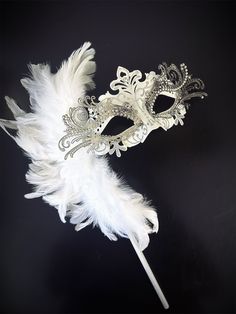 Our mask is adorned with shimmering rhinestones and glitter, casting a spell of enchantment with every glance. Delicate white feathers gracefully frame the mask, adding an extra touch of sophistication and swaying with every movement.


Age Group/Gender - Adult/Women

Size/Type - One size fits all adults

Mask Color - White/Silver

Mask Material - Lasercut metal/Polyresin

Special Features - Feathers White Eye Mask For Masquerade, Elegant White Masquerade Mask For Carnival, Elegant White Masquerade Mask For Mardi Gras, Elegant White Eye Mask, Elegant White Masquerade Mask, White Mardi Gras Masquerade Masks, White Masks For Carnival Party, White Party Masks For Carnival, White Carnival Party Mask