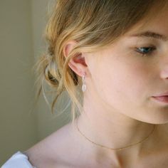 Everyone's favorite, moonstone, is a gorgeous milky white color that is sure to be a favorite. These earrings are just made to be worn every day! Details: Hoops measure 12 mm or 15 mm Sterling Silver or Gold Fill Model is wearing our 15mm hoop in the second photo and 12mm in the 4th + 5th photo Why two sizes? Everyone's earlobe is different maybe your piercing isn't centered or you have short/long earlobes. Not all hoops will fit you so we offer two different sizes a smaller 12mm size and a larg Birthstone Jewelry Mothers, Holiday Stocking, New Best Friend, White Moonstone, Forever Jewelry, Milky White, Everyday Earrings, Engagement Ring Wedding Band, Birthstone Jewelry