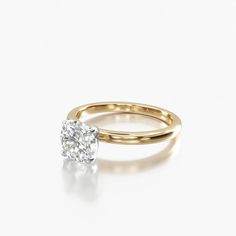 a rose gold engagement ring with an oval cut diamond in the center, on a white background