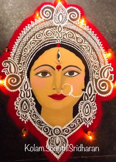 the face of a woman painted in white and red with lights around her eyes on a black surface