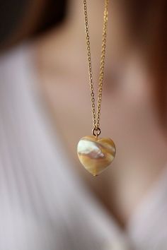 This delicate unique necklace was made of natural mother of pearl beige heart pendnat and high quality gold tone stainless steel chain with gold tone lobster claw. The chain is from lead & nickel free metal. Perfect jewelry for everyday wear and a great gift for someone special! The length of necklace is 45 cm or 17.7 inches. Other necklaces of my shop you can see here: https://www.etsy.com/shop/NaTavelli?section_id=14843046&ref=shopsection_leftnav_5 Thanks for a visit. Pearl Teardrop Gemstone Necklaces, Jade Pendant Beaded Necklaces As Gift, Teardrop Pearl Gemstone Necklaces, Jade Pendant Beaded Necklaces For Gifts, Mother Of Pearl Pendant Jewelry Gift, Teardrop Pearl Necklaces With Gemstones, Jade Pendant Necklaces For Crafting, Jade Pendant Beaded Necklace For Gifts, Jade Beaded Pendant Necklaces As Gift