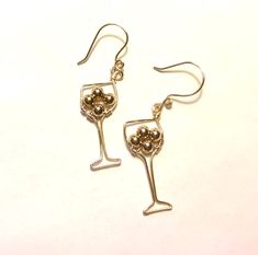 "Fun wine glass shape silver earrings with wire wrapped deep red beads ...each earring has 4mm red beads.  Made of 18 gauge non tarnish wire.   Ear hooks are 20g. Wire with 4mm clear crystal bead.  Drop length little over 2\".   You can also choose a Gold version ! - gold plated wire, non tarnish.  * Great gift for the Wine lover! 🍷" Silver Wire-wrapped Earrings For Party, Silver Wire Wrapped Earrings For Party, Silver Wire Wrapped Beaded Earrings For Party, Silver Earrings With Round Beads For Celebration, Aromatherapy Jewelry, Chainmaille Bracelet, Red Beads, Earrings Red, Wine Lover