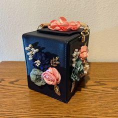 This Is A Gorgeous Little Purse For Summertime, Weddings, Dinners Out Or Proms. Take It Anywhere. New, Never Used, 6” Tall, 4.75”Wide, Has Flowers On Two Sides, And One Flower On Top, Very Clean On The Interior, Has 5 Brass Tacks On The Bottom, The Handle Is Blue With Gold On The Underside. Comes With A Chain That Is Twisted With Gold And Blue So You Can Use It As A Crossbody Bag. New But Does Not Have Tags. Formal Pink Box Bag With Detachable Handle, Handheld Evening Bag For Gift, Elegant Box Bag With Removable Pouch For Gift, Pink Square Box Bag For Party, Formal Pink Top Handle Box Bag, Gift Rectangular Box Bag With Removable Pouch, Gift Box Bag With Removable Pouch In Rectangular Case, Pink Top Handle Box Bag For Party, Pink Handheld Box Bag For Formal Occasions