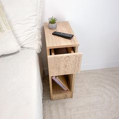 a small wooden table with a remote control on it