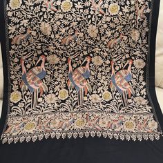 Pashmina Stole With Tilla Work ( Gold Thread Embroidered Work ) What Is Tilla Work ? Kashmiri Tilla Embroidery Is A Highly Skilled And Time-Consuming Process. It Involves The Use Of A Specialized Needle, Which Is Used To Create Intricate Designs On The Fabric. The Metallic Threads, Which Are Often Made Of Gold Or Silver, Are Then Sewn Onto The Fabric, Creating A Raised And Textured Effect. Size: Width: 28 Inches Length: 80 Inches . Traditional Silver Fabric With Resham Embroidery, Traditional Silver Embroidered Fabric With Resham Embroidery, Silver Embroidered Saree With Traditional Drape, Elegant Multicolor Embroidered Shawl For Wedding, Wedding Pashmina With Intricate Embroidery, Wedding Pashmina Shawl With Intricate Embroidery, Elegant Embroidered Pashmina Shawl For Traditional Ceremonies, Wedding Shawl With Multicolor Embroidery And Traditional Patterns, Black Wedding Shawl With Motifs