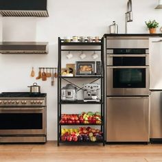 a kitchen with stainless steel appliances and open shelving