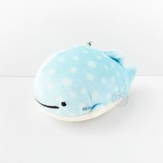 a blue whale stuffed animal with white polka dots