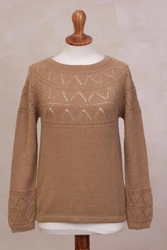 Enjoy the soft touch of baby alpaca wool when you pull on this cozy sweater from Peru. By Marleny Quijahuaman the sweater comes in a warm camel color. Triangular pointelle motifs are added to the bodice and sleeves of the lovely garment. Cashmere Pointelle Knit Sweater For Fall, Fall Textured Knit Alpaca Sweater, Long Sleeve Merino Wool Sweater In Pointelle Knit, Brown Knitted Cashmere Sweater, Long Sleeve Merino Wool Sweater With Pointelle Knit, Long Sleeve Merino Wool Pointelle Sweater, Brown Cashmere Knitted Sweater, Casual Alpaca Textured Knit Sweater, Cozy Fine Knit Brown Sweater