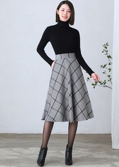 Plaid Lined Skirt For Winter, Plaid A-line Skirt With Lining, Elegant Plaid Knee-length Skirt, Elegant Knee-length Plaid Skirt, Winter Full Mini Skirt With Lining, Winter Workwear Plaid Mini Skirt, Plaid Mini Skirt For Winter Workwear, Elegant Plaid Skirt, Elegant Plaid Winter Skirt