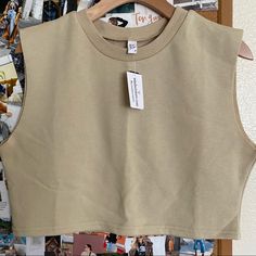 Cropped Casual Sleeveless Sweater #Cropped. Pair It With Biker Shorts Or Joggers. #Sizem Trendy Beige Vest Crop Top, Beige Cropped Vest Top, Khaki Fitted Sleeveless Crop Top, Casual Cropped Beige Tank Top, Casual Beige Cropped Tank Top, Beige Sleeveless Crop Top Casual Style, Casual Beige Sleeveless Crop Top, Khaki Stretch Sleeveless Tops, Trendy Cotton Cropped Vest