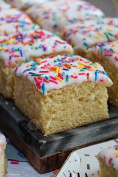 cake with white frosting and colorful sprinkles