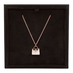 This Necklace is in 18k rose gold with a rose gold Kelly bag pendant set with 38 round brilliant diamonds with a .39 ct weight. Origin: France Condition: Pristine; new or never worn Accompanied by: Hermes box, brown jewelry box and ribbon Measurements: Length: 16 in, Pendant 18mm x 11mm Prada Jewelry, Brown Jewelry, Hermes Box, Kelly Bag, Rose Gold Necklace, Rose Gold Diamonds, Brilliant Diamond, Pendant Set, 18k Rose Gold