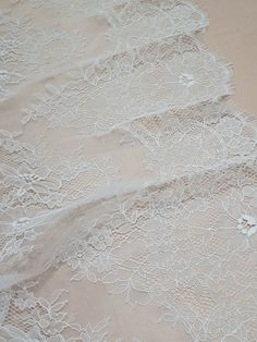 "Off white lace fabric. Both sides are scalloped. Width: 154 cm/60.6 inches Item number: LK3004 Made in Europe www.LaceToLove.com Price is set for one meter/yard. You will receive the fabric in one continuous piece if you purchase more than 1 meter/yard. IMPORTANT! Maximum one piece length of this lace is 3 meters/yards. If you buy more than 3 meters/yards of this lace you will receive it in several pieces. Actual color may vary greatly form the color you see on screen. It depends on your device White Lace Fabric, Veil Lace, Lace Veil, Lace Veils, Wedding Lace, Lace Bridal, Chantilly Lace, Lace Lingerie, Lace Weddings