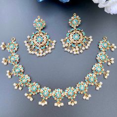 Featuring a beautiful handcrafted floral necklace in 22ct gold. The necklace set has been embellished with pearls and turquoises. The necklace weigh 25.25 GMs including 2.48 GMs in hanging beads. The earrings weigh 19.27 GMs including 2.57 GMs in hanging beads. Price Breakup Summary Component Rupees % of Total 22k Gold 191,124 76.3% Stones & Beads 17,806 7.1% Making Charges 34,402 13.7% Taxes (GST) 7,300 3.0% Total 250,632 100.0% View Detailed Price Breakup Latest Gold Necklace, Gold Necklace Sets, 22k Gold Jewelry Necklaces, 22k Gold Jewelry, Hanging Beads, Pearl Necklace Set, Necklace Sets, Gold Jewelry Necklace, Gold Necklace Set