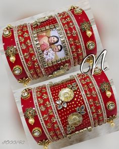 Red Color Indian Bridal Photo Chura Set. Decorated With Beautiful Hand Painting. Center Piece Is Beautified With Floral Shape Metal Figure. Hanging Pearls & Glass Stone Kangan At Both Ends Of This Chura Is Making This Ensemble More Desirable. This is a set of 22 Bangles (11 For Each Hand). Note: We Can Put Your Picture Into The Frame On Center Bangle. Simply Send Us Your Picture After Ordering It. Red Ceremonial Bridal Sets For Festivals, Heavy Red Wedding Sets, Red Meenakari Bridal Sets For Wedding, Ceremonial Red Bridal Sets With Stone Work, Heavy Red Traditional Wear For Festive Occasions, Red Bridal Sets With Stone Work For Marriage, Red Traditional Wear For Marriage, Red Traditional Marriage Wear, Red Kundan Bridal Set For Ceremonial Use