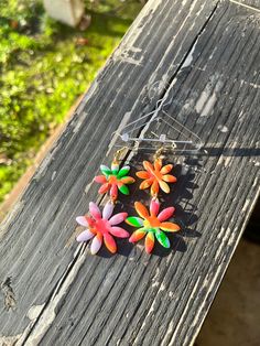 Introducing these vibrant and charming daisy-shaped polymer clay earrings - a delightful addition to your accessory collection! These earrings are a celebration of colors and nature-inspired design, handcrafted to bring joy and style to your everyday look. Key Features: Vibrant Multicolored Design: These earrings boast a captivating daisy shape with a burst of lively, multicolored petals. The vivid hues create a cheerful and playful aesthetic that is perfect for any occasion. Polymer Clay: Metic Playful Multicolor Handmade Flower Earrings, Playful Handmade Multicolor Flower Earrings, Playful Multicolor Flower Earrings As Gift, Colorful Spring Earrings For Gifts, Colorful Spring Earrings As Gift, Colorful Earrings As Spring Gift, Colorful Spring Earrings For Gift, Colorful Spring Gift Earrings, Whimsical Multicolor Flower Charm Earrings