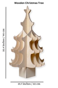 the wooden christmas tree is shown with measurements