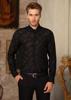 Your friends will see straight through you... partially sheer, this black Mondo shirt adds elegance and mystery that is emblematic of Mondo's freedom, empowerment and individualism Limited Edition Sheer custom fabric Semi-see through Custom metal square button French placket Button-down collar Long sleeves with rounded, single-button cuffs Rounded hem Cotton Dry clean suggested Designer Long Sleeve Shirt For Party, Black Sheer Long Sleeve Shirt, Designer Black Shirt For Business, Fitted Black Sheer Shirt, Designer Black Business Tops, Designer Black Office Shirt, Fitted Sheer Black Shirt, Designer Black Tops For Business, Black Slim Fit Top For Semi-formal Occasions