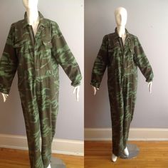 Loving This Vintage Camouuflage Boiler Suit OVERSIZE VIBE Versatile, Comfortable, Gender Neutral Jumpsuit Step In Zipper Front  Utility Pockets Excellent Vintage Condition Label: World Famous Camouflage Suit Fabric Content:  100% Cotton Tag Reads Size XL Oversize, Baggy Fit Please Refer To Measurements To Ensure Proper Fit Excellent Vintage Condition With Jumpsuit lying flat in inches: Shoulders: 20 Underarms: 23 Waist: 21 Hips: 24 Inseam of Arm: 22 Top of Shoulder To Crotch: 34 Inseam of Leg:  31 Military Style Cotton Overalls, Military Style Jumpsuits And Rompers With Pockets, Military Style Long Sleeve Cotton Jumpsuits And Rompers, Military Style Long Sleeve Cotton Jumpsuit, Military Style Khaki Jumpsuit, Military Style Long Sleeve Khaki Jumpsuit, Khaki Military Long Sleeve Jumpsuit, Khaki Military Style Long Sleeve Jumpsuits, Military Style Green Overalls With Pockets