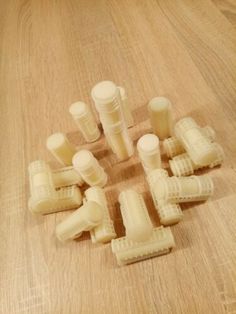 several pieces of plastic sitting on top of a wooden table