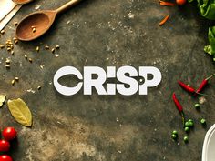 the word crsp is surrounded by various vegetables and spoons on a gray surface