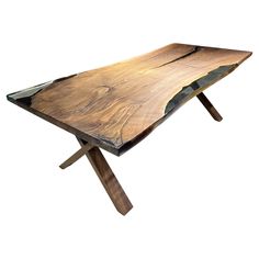 a wooden table with metal legs and a slab of wood on the top that has been cut in half