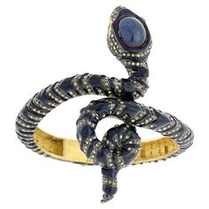 14k:10.9g, Diamond:7.2ct, Silver:51.38gm, Sapphire:20ct Size: 49X58 MM"