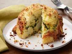 a close up of a plate of food with broccoli and cheese on it