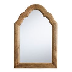 a wooden mirror with an arch shaped frame on the top and bottom, against a white background