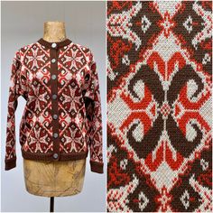 * Women's wool cardigan c 1960s/1970s * Nordic style snowflake pattern in burnt orange and brown on ivory background * Brown ribbing at wrist, hem, collar and front placket * Long, set-in sleeves  * 7 embossed metal snowflake button front closure Label: Tami Excellent condition  Bust: 42 Shoulder: 18 Sleeve: 21 Length: 21 Garments are flat-measured. Please compare these measurements to another flat-measured garment that fits you correctly for size comparison. Don't forget to leave room for body Retro Wool Cardigan With Fair Isle Pattern, Vintage Brown Cardigan For Fall, Retro Orange Cardigan For Winter, Retro Orange Winter Cardigan, Vintage Wool Cardigan With Fair Isle Pattern, Vintage Brown Wool Cardigan, Vintage Brown Cardigan For Winter, Vintage Brown Winter Cardigan, Vintage Brown Sweater With Fair Isle Pattern