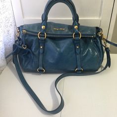 Beautiful Miu Miu Bag 100% Authentic Light Blue Color With Gold Hardware Designer Blue Bag With Double Handle, Designer Blue Satchel With Adjustable Strap, Miu Miu Shoulder Bag With Double Handle, Miu Miu Double Handle Shoulder Bag For Everyday Use, Miu Miu Top Handle Bags With Gold-tone Hardware, Miu Miu Tote Bag For Daily Use, Blue Designer Satchel With Dust Bag, Blue Designer Satchel Shoulder Bag With Dust Bag, Designer Blue Satchel Shoulder Bag