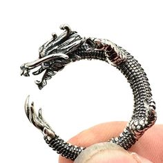 Sterling Silver's Very Cool Mens Womens Ring, A Size 8, Features A Fiery Red Garnet-Eyed Dragon Design. Crafted From Sterling Silver, It's A Standout Piece For Any Jewelry Collection. Made By Sterling Silver Size 8 Red Garnet Eyes Dragon Style Design Weighs 10 Grams Ideal For Women Or Men Sterling Silver Features: Dragon, 10 Grams Size: Womens Size 8 Condition: Pre-Owned Good Vintage And Or Estate Jewelry Items. These Items Are Preowned Items And May Have Been Previously Worn. These Jewelry Item Womens Ring, Fiery Red, Dragon Design, Red Garnet, Ring Sterling Silver, Womens Jewelry Rings, Fine Silver, Estate Jewelry, Style Design