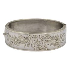 A Victorian hinged bangle hallmarked sterling silver, Birmingham 1882. There are a few tiny dinks to the plain side, otherwise in good condition, the catch is in good working order.  The internal measurements are 5.7 cms (2 1/4 inches) x 4.7 cms (1 3/4 inches). The internal circumference is 16.5 cms (6 1/2 inches), The bangle is 1.9 cms (3/4 of an inch) wide. For more bangles please look at my bracelets and bangles section here; https://www.etsy.com/uk/shop/DaisysCabinet?section_id=16212877&ref= Luxury Antique Style Sterling Silver Bangle, The Catch, Silver Gifts, Hinged Bangle, Antique Victorian, Uk Shop, Birmingham, Favorite Jewelry, Bangle Bracelets