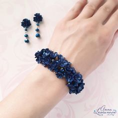 "Navy blue bracelet Dark blue bracelet Navy blue jewelry set Blue flower bracelet Blue bridesmaid bracelet Dark blue jewelry gift Blue wedding Dark blue bracelet with flowers and crystal beads. This bracelet will be a great addition to your look. This bracelet looks great with a bridesmaid dress. It also looks good with a wedding dress if the wedding color is blue. This bracelet will be your favorite. Length of the bracelet approx 18.0см / 7.08\" + extension chain 5см / 1,97\" Please, let me know the scope of your wrist, so I could make the desired bracelet length. A necklace is suitable for these bracelet : https://etsy.me/3nCAimS our https://etsy.me/3fAJMdX A earrings is suitable for these bracelet : https://etsy.me/3rtOiQX A ring is suitable for these bracelet : https://etsy.me/3FzwWHj Formal Sapphire Flower Jewelry, Adjustable Blue Crystal Bracelet For Wedding, Blue Flower-shaped Formal Jewelry, Blue Elegant Beaded Bracelets For Formal Occasions, Elegant Blue Beaded Bracelets For Formal Occasion, Elegant Flower Crystal Bracelet For Weddings, Blue Bangle Bracelets For Wedding, Blue Bangle Bracelet For Wedding, Adjustable Sapphire Bracelets For Wedding