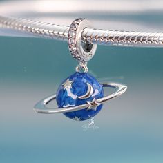 This is charm only, bracelet is sold separately. This beautiful enamel blue planet pendant charm is made of solid 925 sterling silver and enamel color, features 3D blue planet with moon and star. This planet dangle charm will fit original bracelet or wear as a pendant for necklace. Experience the wonder of the universe with our stunning Blue Planet pendant charm! Crafted from solid 925 sterling silver and vibrant enamel, this charm showcases a 3D blue planet adorned with a glowing moon and star. Sterling Silver Space-themed Jewelry, Silver Star Charm Celestial Charms, Silver Star Charm With Celestial Style, Silver Star Charm Celestial, Blue Star Charm Round Pendant Jewelry, Silver Celestial Star Charm, Celestial Sterling Silver Jewelry With Dangling Charms, Silver Dangle Moon Charm, Celestial Jewelry With Dangling Charms In Sterling Silver