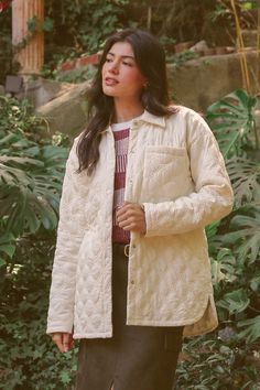 The Quilted Floral Shacket is a stylish and versatile jacket perfect for any occasion. Featuring a unique quilted floral motif and convenient snap button closure, this jacket is both fashionable and functional. With pockets for added convenience, it is made of a comfortable blend of 90% polyester and 10% nylon. Elevate your wardrobe with this must-have piece. Quilted Beige Cotton Outerwear, Quilted Cotton Utility Jacket With Long Sleeves, Beige Quilted Cotton Outerwear, Cotton Quilted Winter Jacket With Snap Buttons, Winter Cotton Quilted Jacket With Snap Buttons, Cotton Quilted Jacket With Button Closure, Quilted Cotton Jacket With Buttons, Cream Quilted Spring Outerwear, Cream Quilted Outerwear For Spring