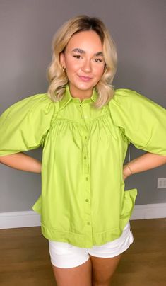 Introducing our Solid Button Up Half Sleeve Top, the perfect addition to your summer wardrobe! This top features a stylish ruffle trim detail at the shoulders, adding a touch of femininity to a classic silhouette. Made from 100% cotton, this top is unlined, woven, and non-sheer, ensuring both comfort and durability. Its lightweight construction makes it ideal for those hot summer days, keeping you cool and stylish throughout the season. Whether you dress it up for a night out or pair it with sho Baby Surprise Announcement, Boho Bandeau, Sweet Grace, Surprise Baby, Half Sleeve Tops, Wax Warmers, Shoe Gifts, Pullover Jacket, Classic Silhouette