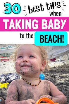 a baby with mud on his face sitting in the sand and holding an orange toy