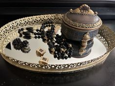 "Gorgeous vintage 1960s black bead jewelry set. Onyx-color Lucite bead necklace with gold bead spacers and two pair of earrings, bead cluster and diamond shaped black and gold enamel. Super versatile set that can be dressed up or down, worn together or separately.  Necklace is 28\" total length with spring ring style clasp. Earrings are both 1\" across with clip on fasteners. Get your gothic glam on or just add some vintage style to jeans and a sweater!" Costume Jewelry With Faceted Beads For Evening, Evening Costume Jewelry With Faceted Beads, Vintage Jewelry With Polished Oval Beads, Party Jewelry With Faceted Beads, Party Jewelry With Oval Faceted Beads, Vintage Black Beaded Jewelry For Formal Occasions, Costume Jewelry With Black Round Beads, Antique Beaded Jewelry For Evening, Antique Jewelry With Spacer Beads