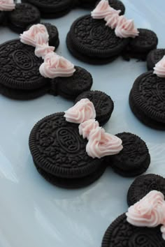 some cookies with frosting on them sitting on a plate