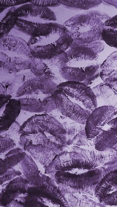 an image of many different types of feathers in the air with purple hues on them